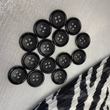 Classic matte black buttons with 4 holes for coats, jackets and other clothes. Set of 6 pieces