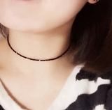 Short necklace, choker made of small beads. Black/White/Pink.